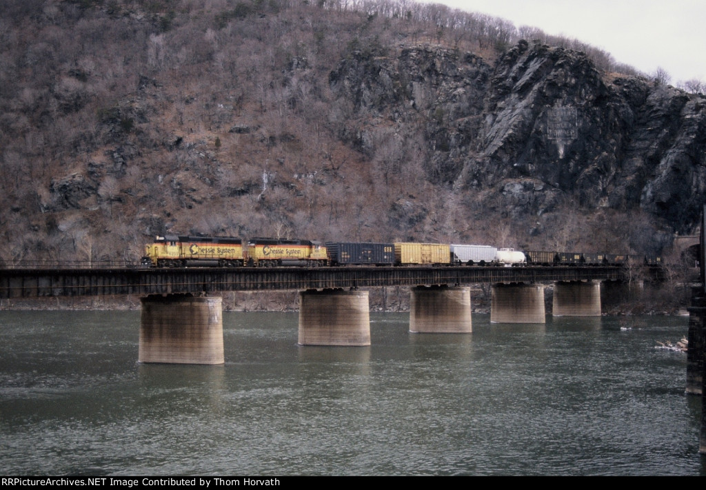 CSX 6235 leads a mixed freight west over the Potomac River